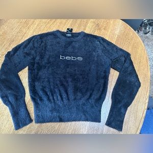 NWT Beautiful Bebe sweater in size large.